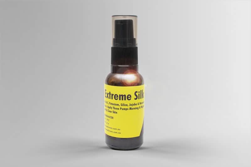 two bottles of extreme brown 100% natural anti-ageing and acne skin serum, brown bottle with yellow label